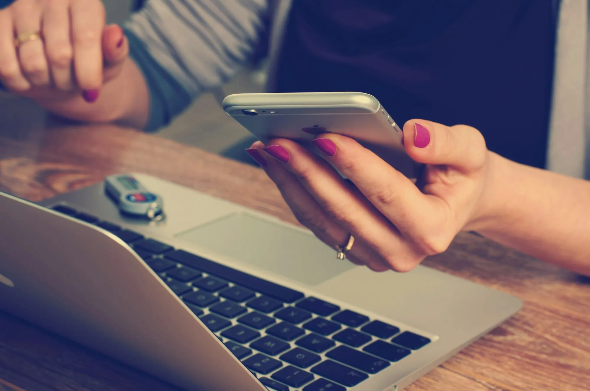 Client using a smartphone and laptop to contact VPR Contractors